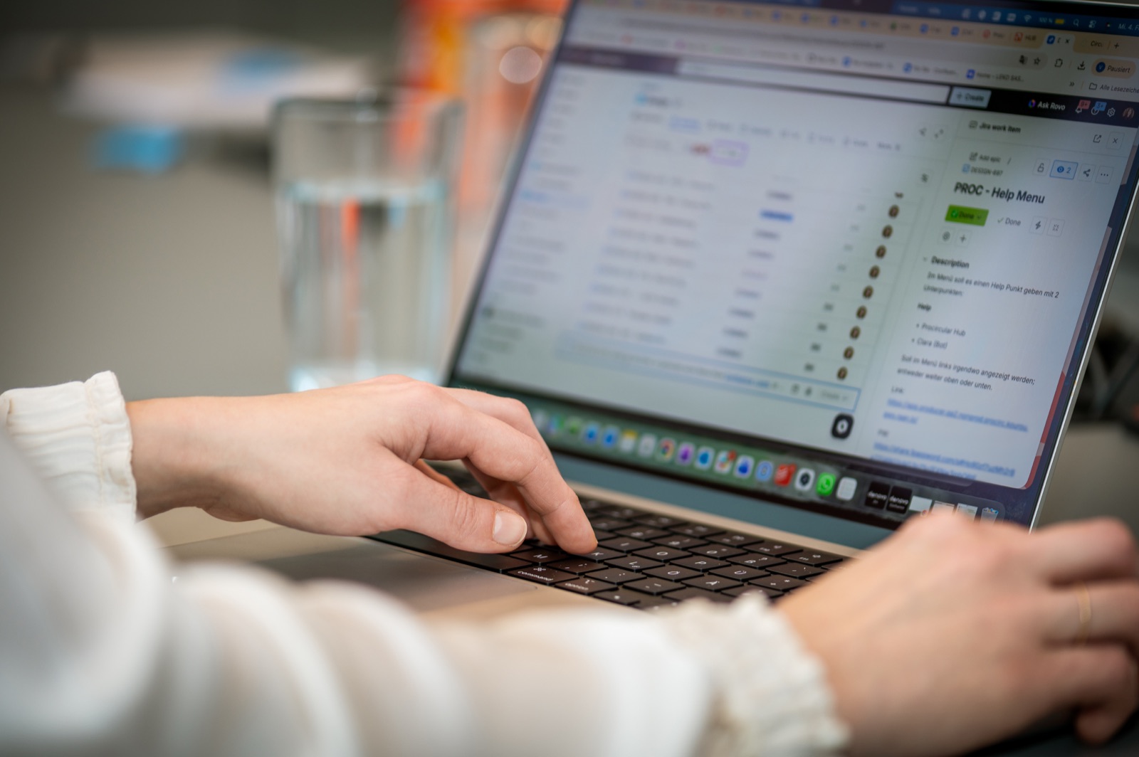 Team member works on a web application on a laptop